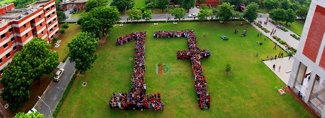 Aerial shot of students forming the digits of 17 in urdu 