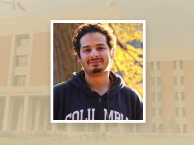 Image of Usama wearing a black hoodie with the SBASSE building in the background 